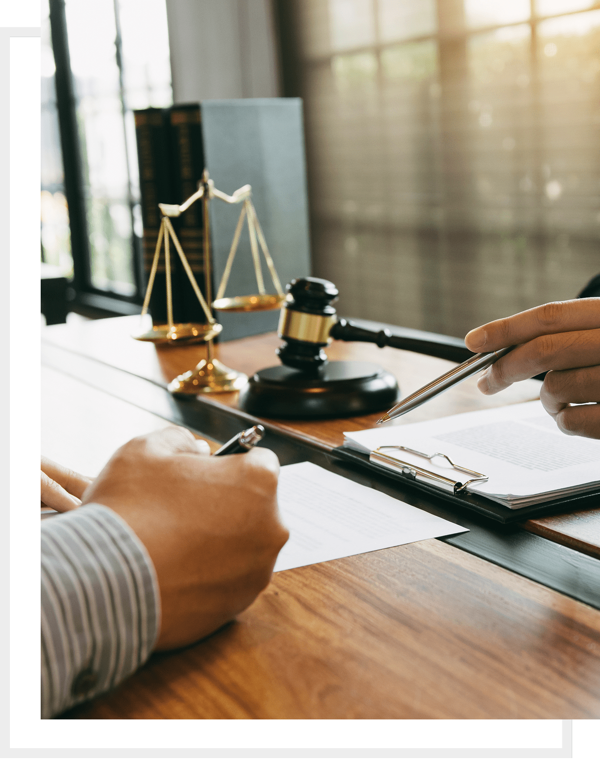 Signing documents at law firm desk